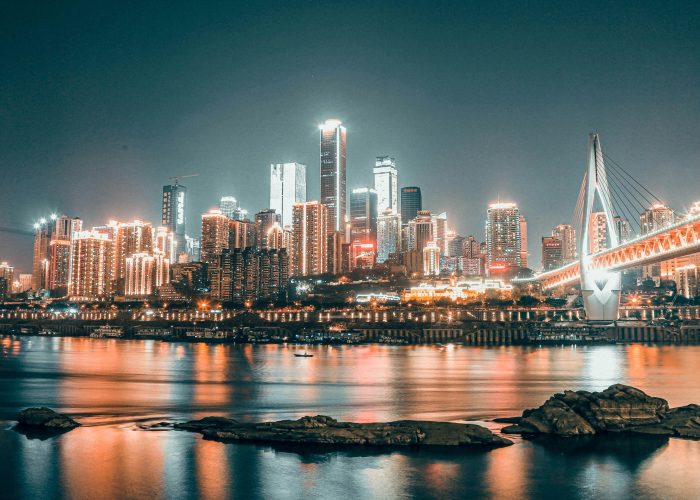 Chongqing skyline at night with illuminated buildings reflected in the river