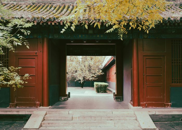 Traditional Chinese courtyard gate with red pillars