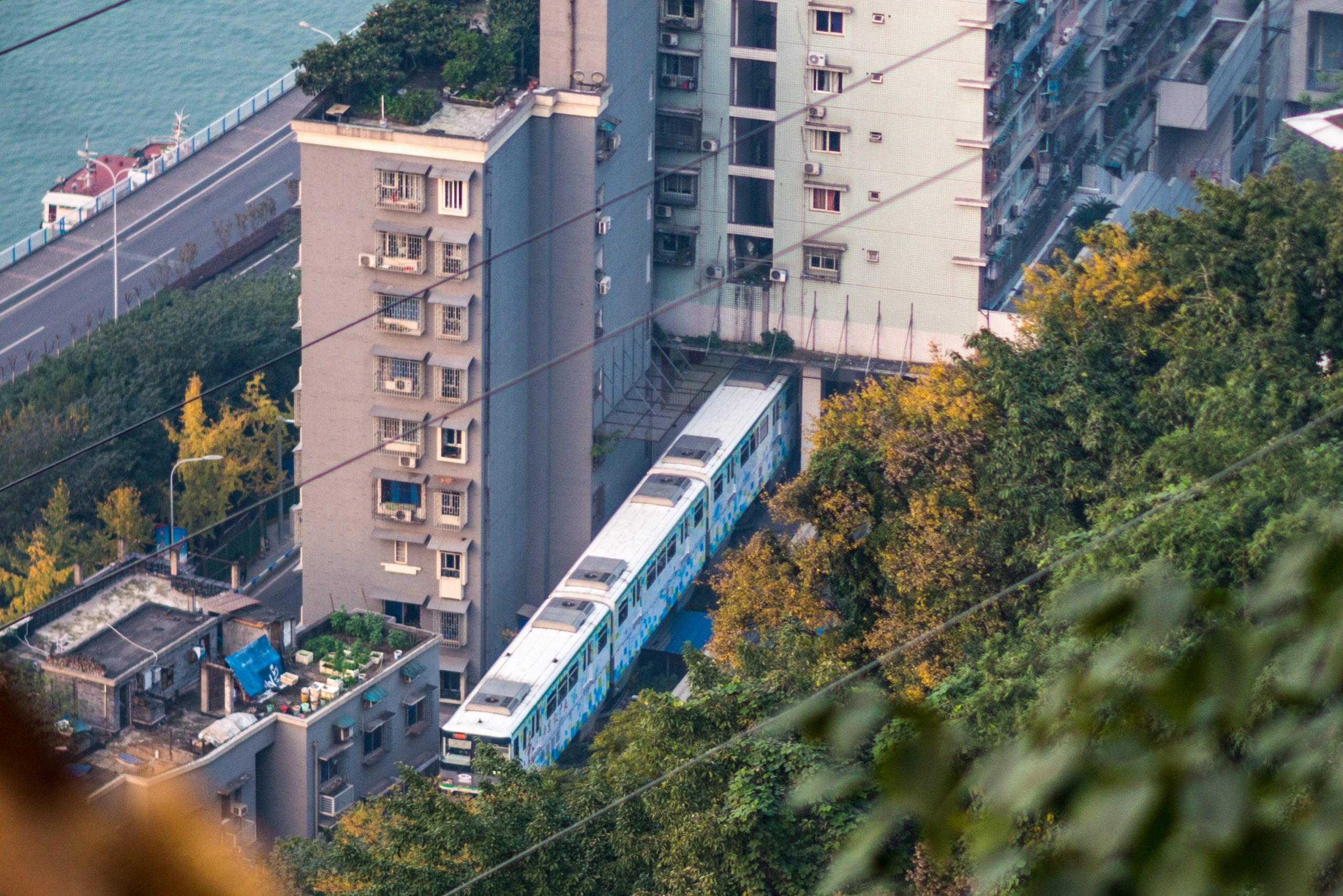 Aerial view of Liziba station and its building with the Jialing River visible in the background.