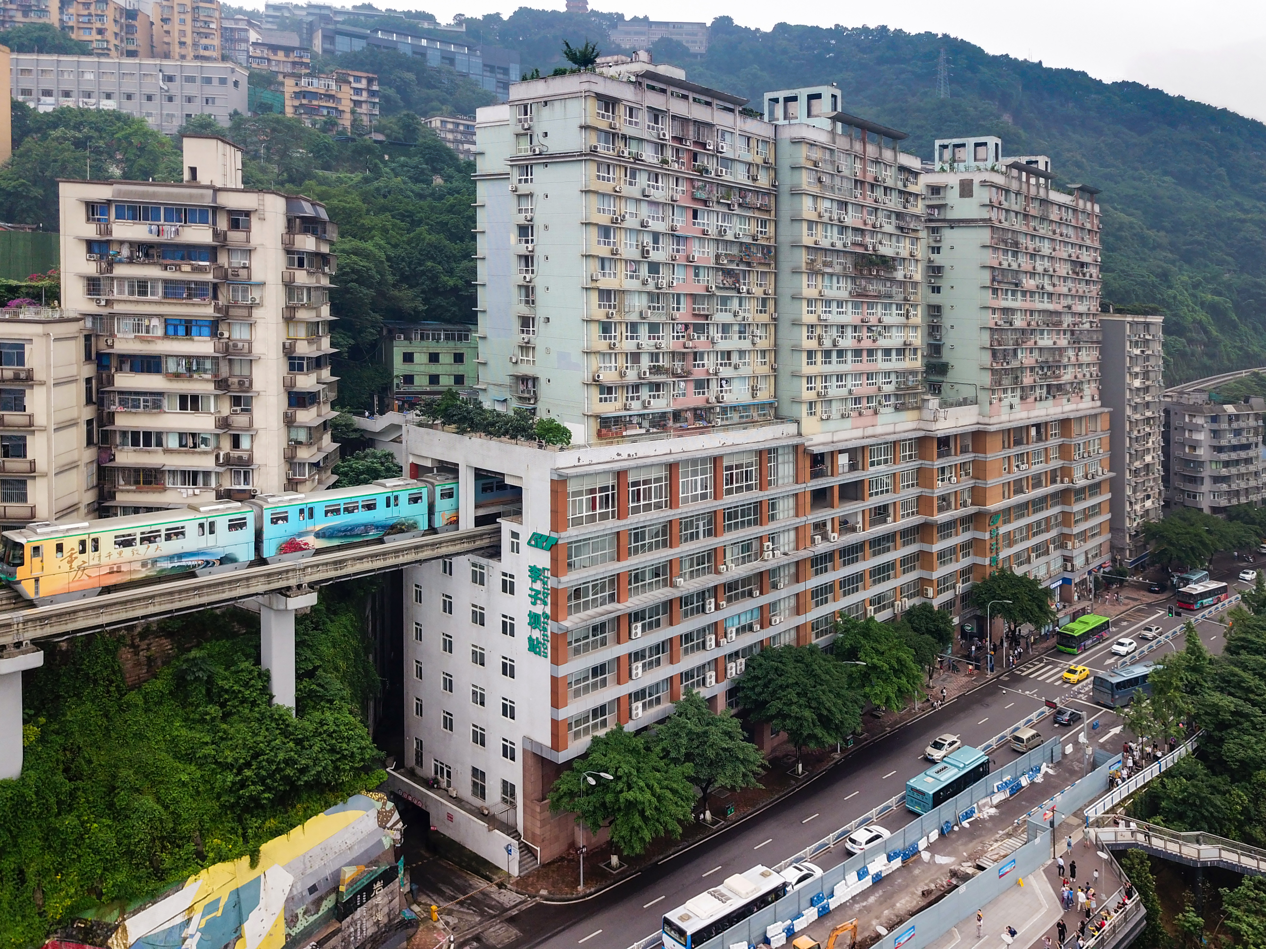 Full view of the 19-storey Liziba building with monorail passing through at the sixth to eighth floors.