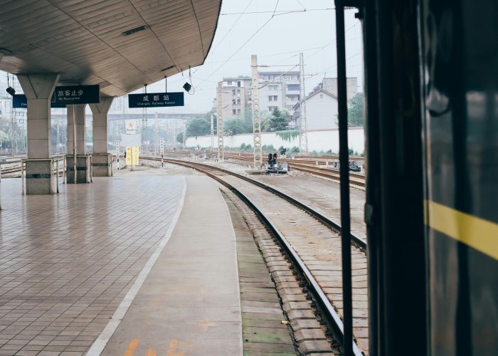 An empty train station in China with curved tracks and room to move