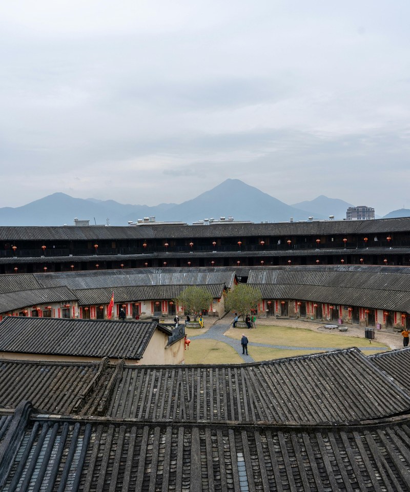 Tulou roundhouse interior with Fujian mountains