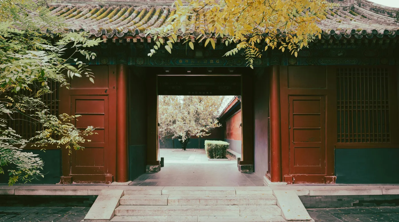 Traditional Chinese courtyard gate with red pillars