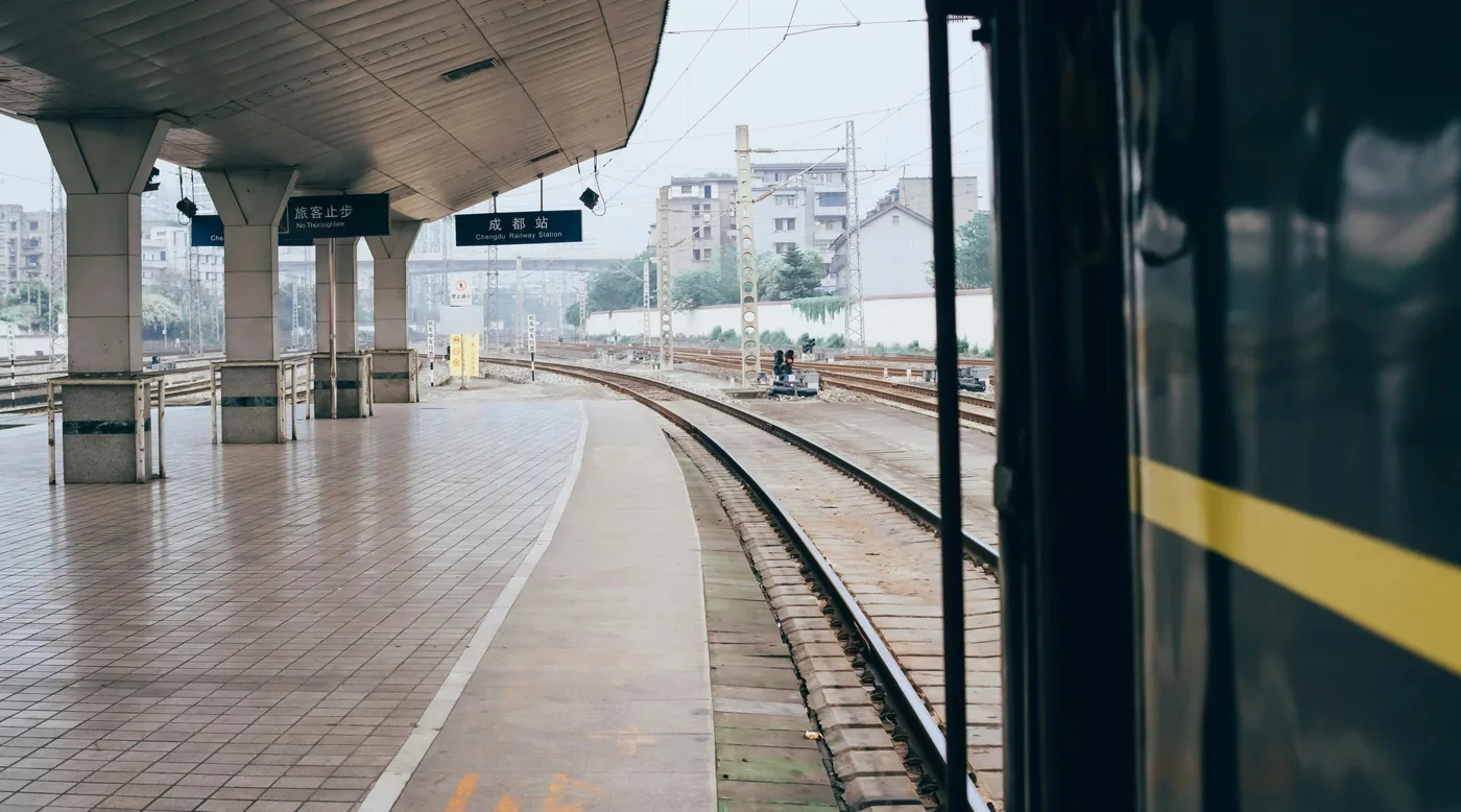 An empty train station in China with curved tracks and room to move