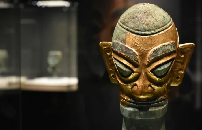 Gold-covered bronze head from Sanxingdui Museum, showing the distinctive angular features and gold foil overlay