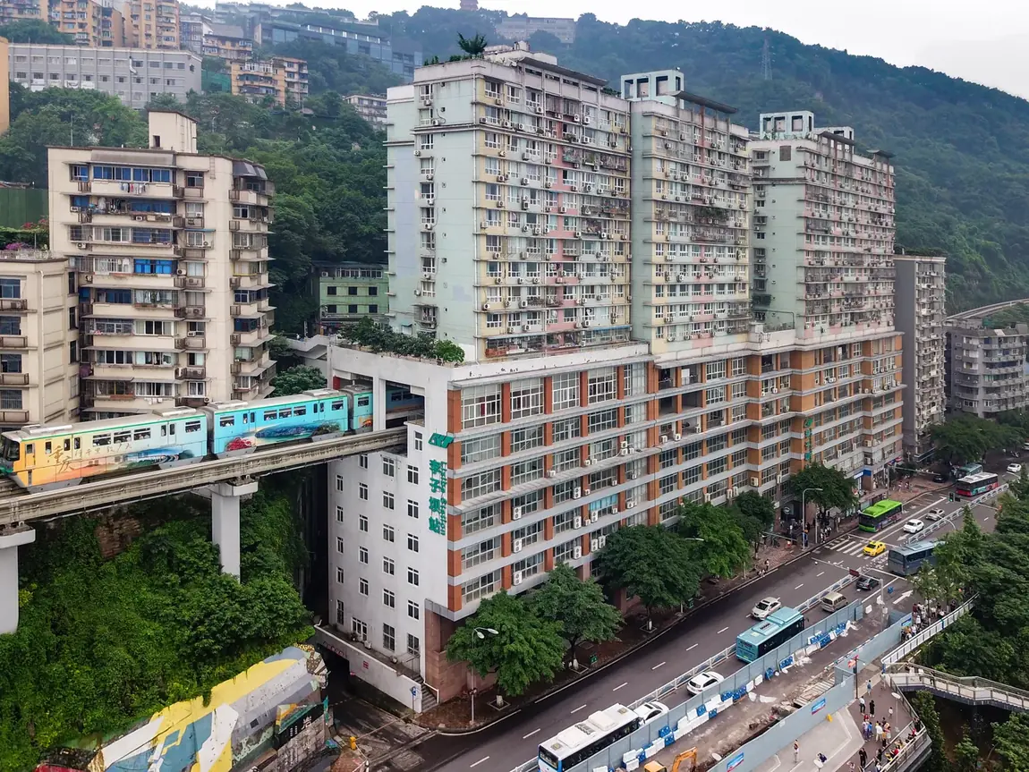 Full view of the 19-storey Liziba building with monorail passing through at the sixth to eighth floors.